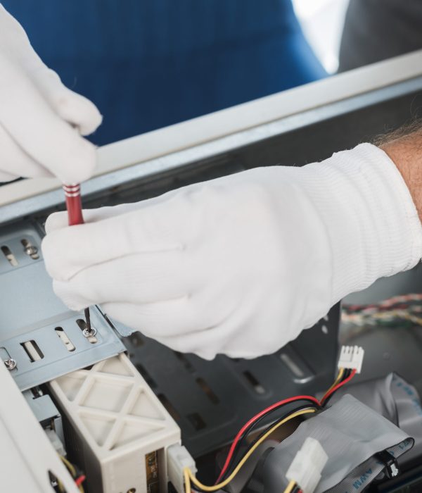 close-up-male-technician-hand-wearing-gloves-repairing-computer